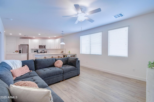 2511 W Queen Creek Rd Unit 374, Chandler, AZ 85248 - living area with baseboards, light wood-type flooring, recessed lighting, and a ceiling fan