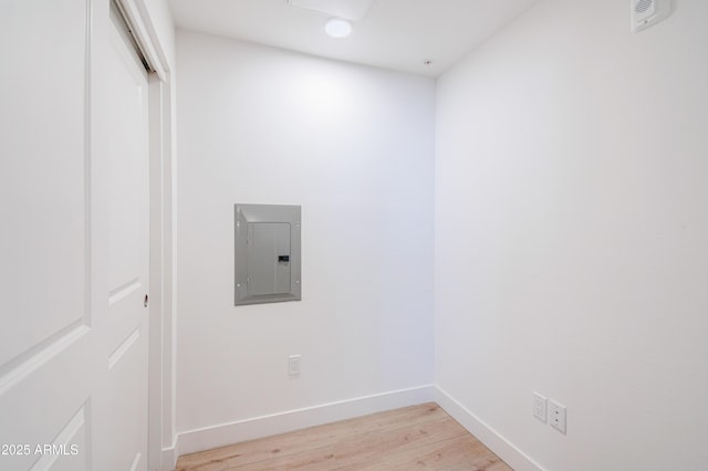 2511 W Queen Creek Rd Unit 374, Chandler, AZ 85248 - laundry room featuring electric panel, light wood-style floors, and baseboards