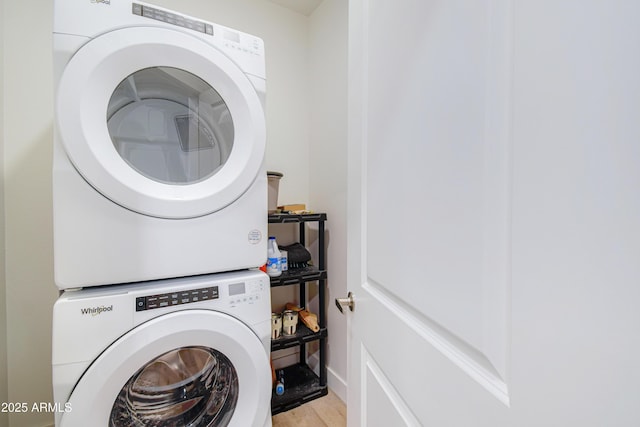 2511 W Queen Creek Rd Unit 374, Chandler, AZ 85248 - washroom with stacked washer and clothes dryer and light wood-style floors