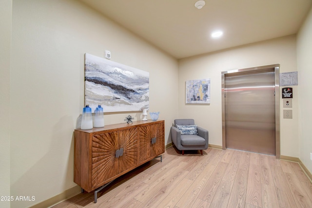 2511 W Queen Creek Rd Unit 374, Chandler, AZ 85248 - living area featuring elevator, wood finished floors, baseboards, and recessed lighting