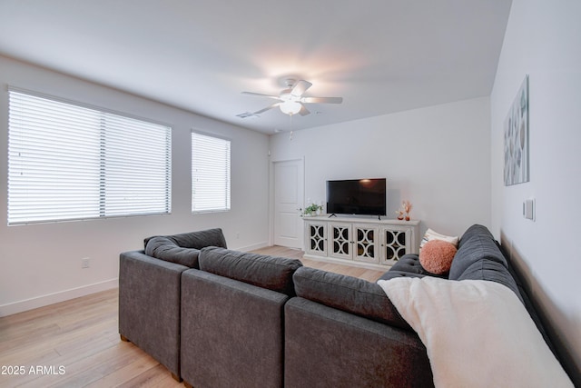 2511 W Queen Creek Rd Unit 374, Chandler, AZ 85248 - living area featuring light wood-style floors, a ceiling fan, and baseboards