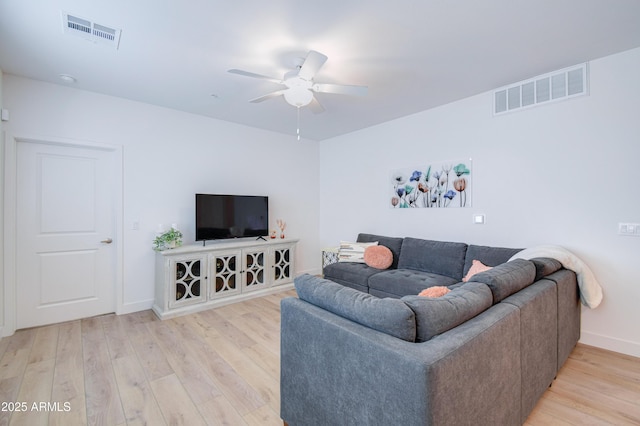 2511 W Queen Creek Rd Unit 374, Chandler, AZ 85248 - living room with a ceiling fan, light wood-style flooring, and baseboards
