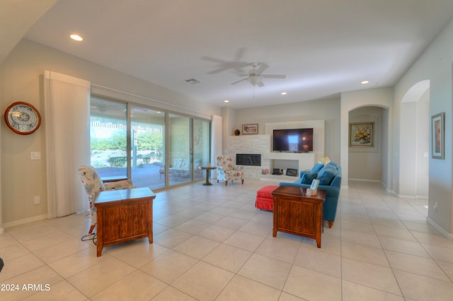 living room with light tile patterned flooring and ceiling fan