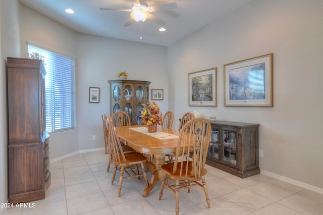 dining area featuring ceiling fan and light tile patterned floors