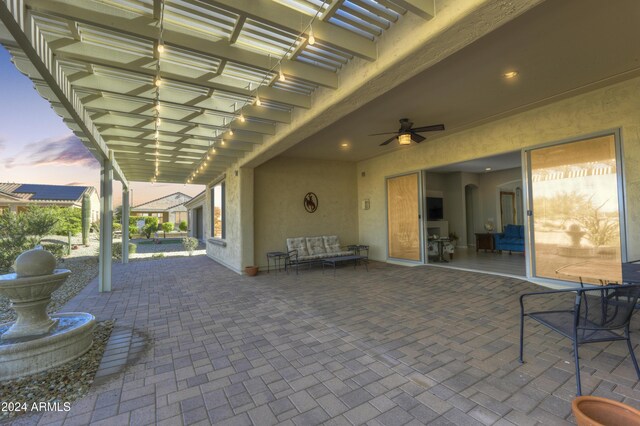 27552 W Tonopah Dr, Buckeye, AZ 85396 - patio terrace at dusk with a patio area, a ceiling fan, and an outdoor hangout area