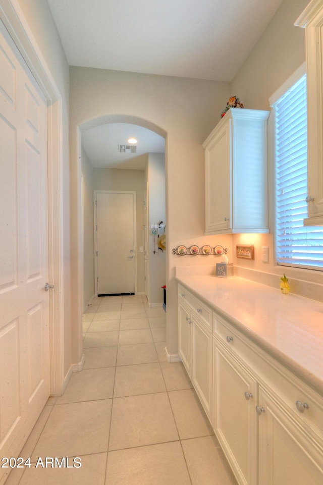 bathroom with vanity and tile patterned floors