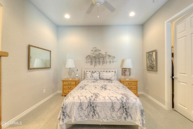 bedroom with light carpet and ceiling fan