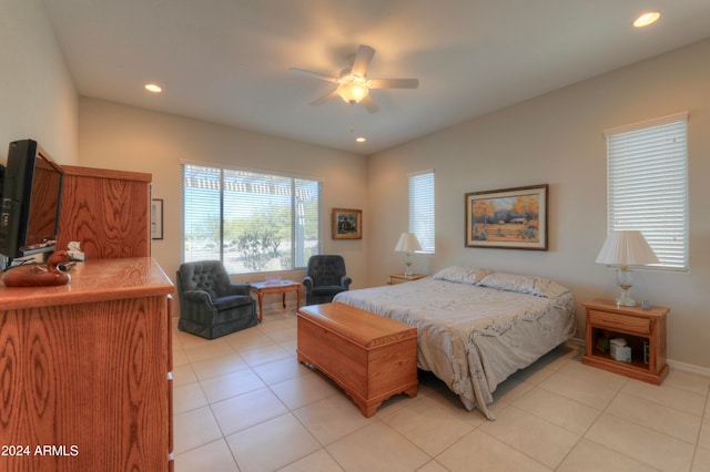 bedroom featuring light tile patterned floors and ceiling fan