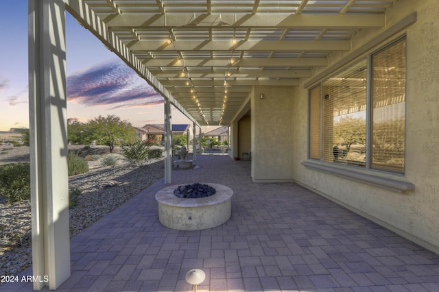 27552 W Tonopah Dr, Buckeye, AZ 85396 - patio terrace at dusk featuring a patio area and a fire pit