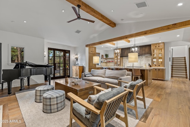 living room with recessed lighting, lofted ceiling with beams, visible vents, and light wood-style floors