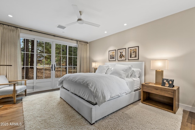 bedroom with recessed lighting, a ceiling fan, visible vents, and wood finished floors