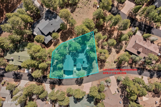 birds eye view of property with a residential view