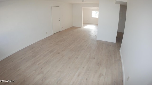 spare room with light hardwood / wood-style flooring