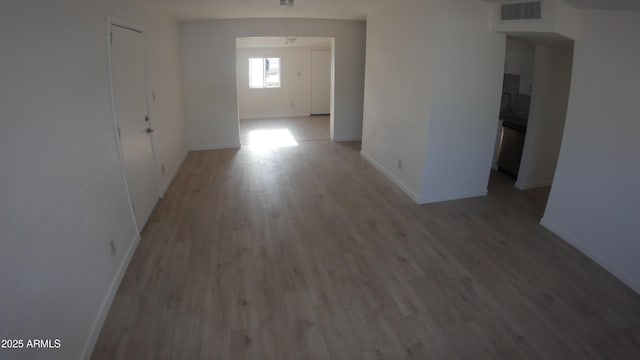hallway with wood-type flooring