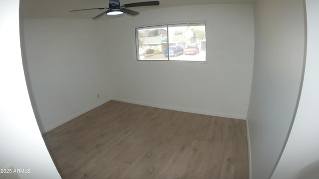 unfurnished room featuring light hardwood / wood-style floors and ceiling fan