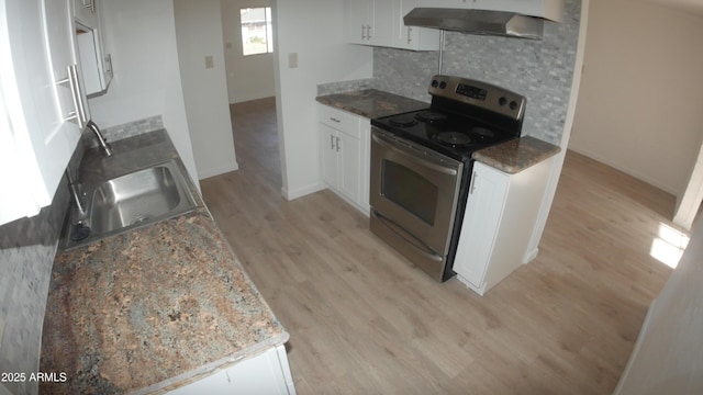 kitchen with white cabinetry, sink, stainless steel range with electric cooktop, and backsplash