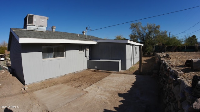 view of side of home featuring central air condition unit
