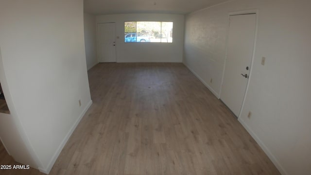 empty room with light hardwood / wood-style floors