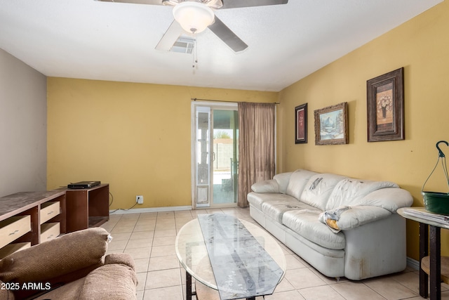 living room featuring light tile patterned floors, baseboards, visible vents, and a ceiling fan