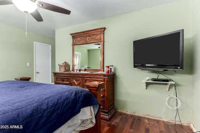 bedroom featuring a ceiling fan and dark wood finished floors