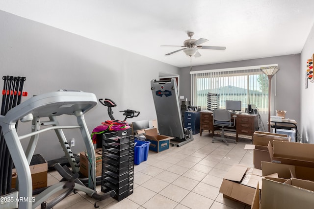 interior space with light tile patterned floors and ceiling fan