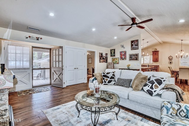 living area featuring recessed lighting, visible vents, ceiling fan with notable chandelier, wood finished floors, and lofted ceiling with beams