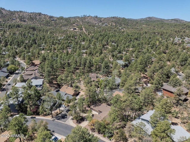 aerial view with a mountain view and a view of trees