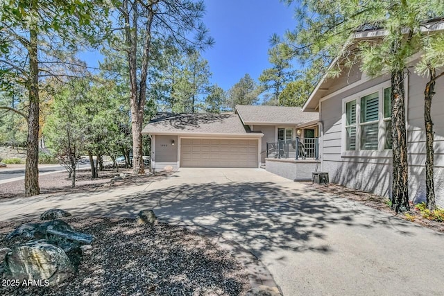 view of front facade featuring concrete driveway and an attached garage