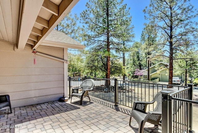 view of patio with a balcony