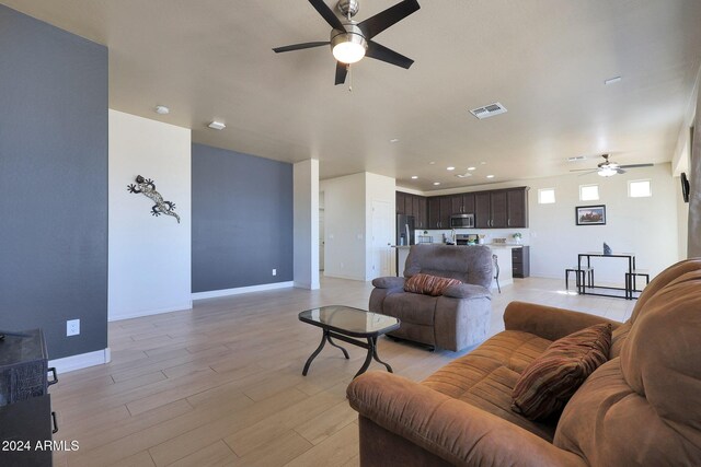 16918 S 180th Dr, Goodyear, AZ 85338 - sitting room with a ceiling fan, baseboards, visible vents, and light wood-style floors