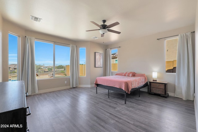 bedroom featuring ceiling fan and dark hardwood / wood-style flooring