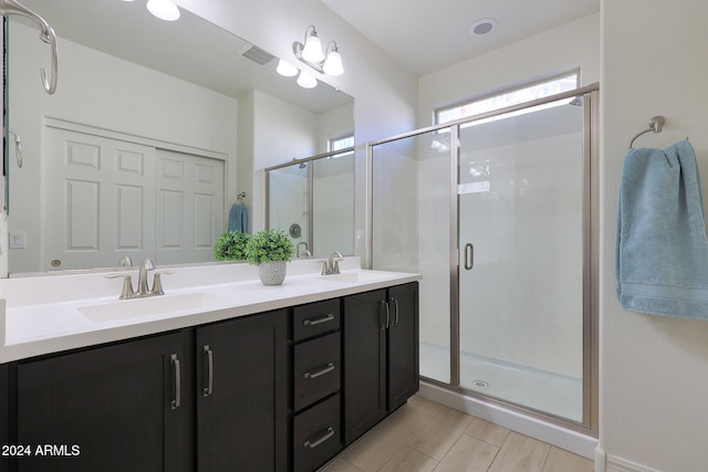 bathroom with vanity and an enclosed shower