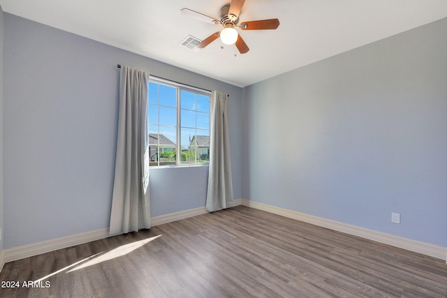 spare room with ceiling fan and hardwood / wood-style floors