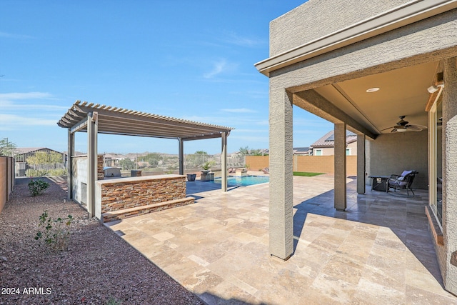 view of patio featuring ceiling fan and a pergola