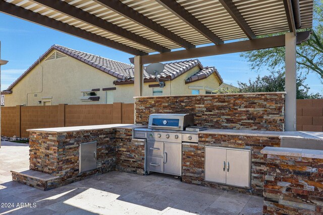 16918 S 180th Dr, Goodyear, AZ 85338 - view of patio featuring a fenced backyard and grilling area