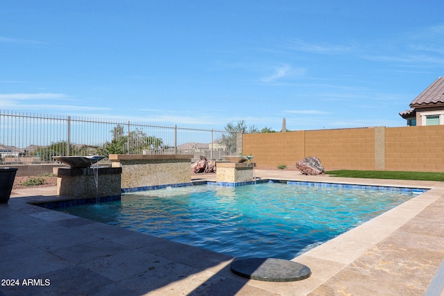 view of pool featuring pool water feature