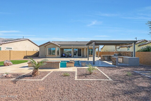 16918 S 180th Dr, Goodyear, AZ 85338 - rear view of property with a fenced backyard, a patio area, stucco siding, and a tile roof