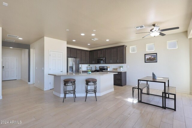 16918 S 180th Dr, Goodyear, AZ 85338 - ranch-style home with a tile roof, concrete driveway, an attached garage, stone siding, and stucco siding
