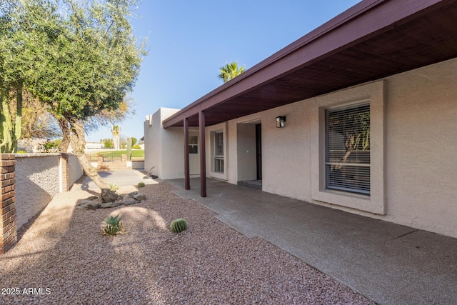 view of yard featuring fence and a patio area