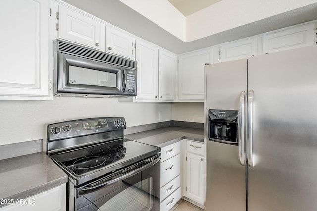 kitchen featuring white cabinets and black appliances