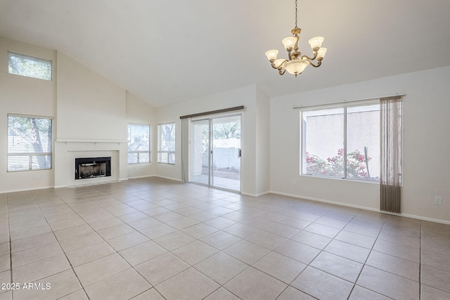 unfurnished living room featuring light tile patterned floors, plenty of natural light, and a fireplace