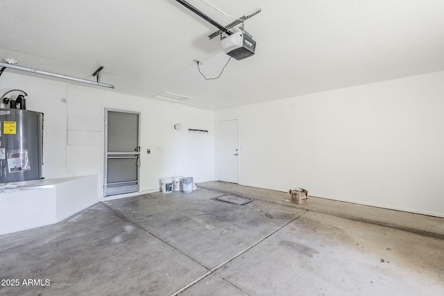 garage featuring electric water heater and a garage door opener