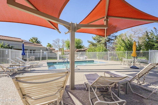 pool featuring a patio and fence