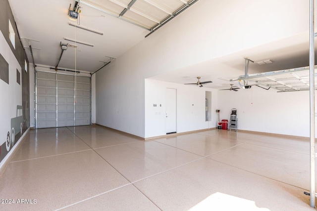 garage featuring a garage door opener and ceiling fan