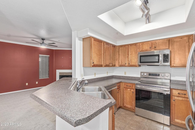 750 E Northern Ave Unit 2045, Phoenix, AZ 85020 - kitchen with appliances with stainless steel finishes, open floor plan, a peninsula, ceiling fan, and a tray ceiling