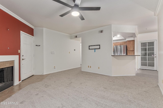 750 E Northern Ave Unit 2045, Phoenix, AZ 85020 - unfurnished living room with carpet floors, a ceiling fan, ornamental molding, a tile fireplace, and a heating unit