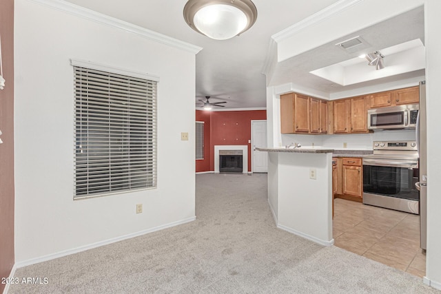 750 E Northern Ave Unit 2045, Phoenix, AZ 85020 - kitchen with stainless steel appliances, light carpet, open floor plan, crown molding, and a ceiling fan