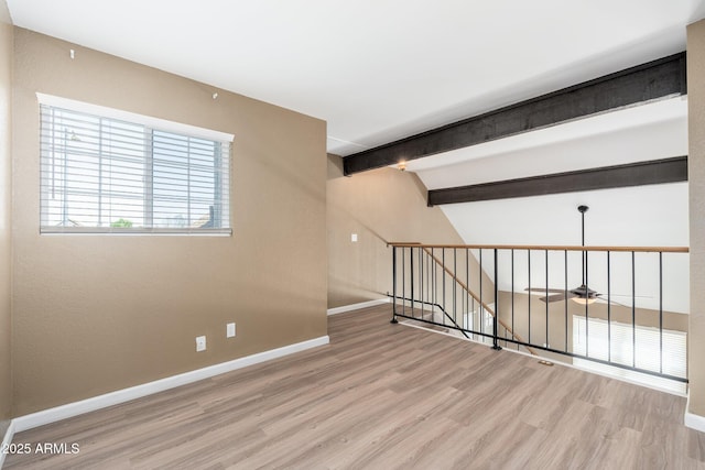 20818 N 21st Dr, Phoenix, AZ 85027 - unfurnished room featuring a ceiling fan, baseboards, lofted ceiling with beams, and wood finished floors
