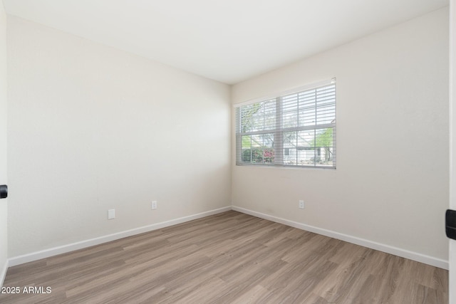 20818 N 21st Dr, Phoenix, AZ 85027 - spare room with baseboards and light wood finished floors