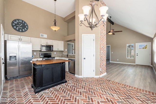 20818 N 21st Dr, Phoenix, AZ 85027 - kitchen featuring wooden counters, visible vents, appliances with stainless steel finishes, high vaulted ceiling, and white cabinetry